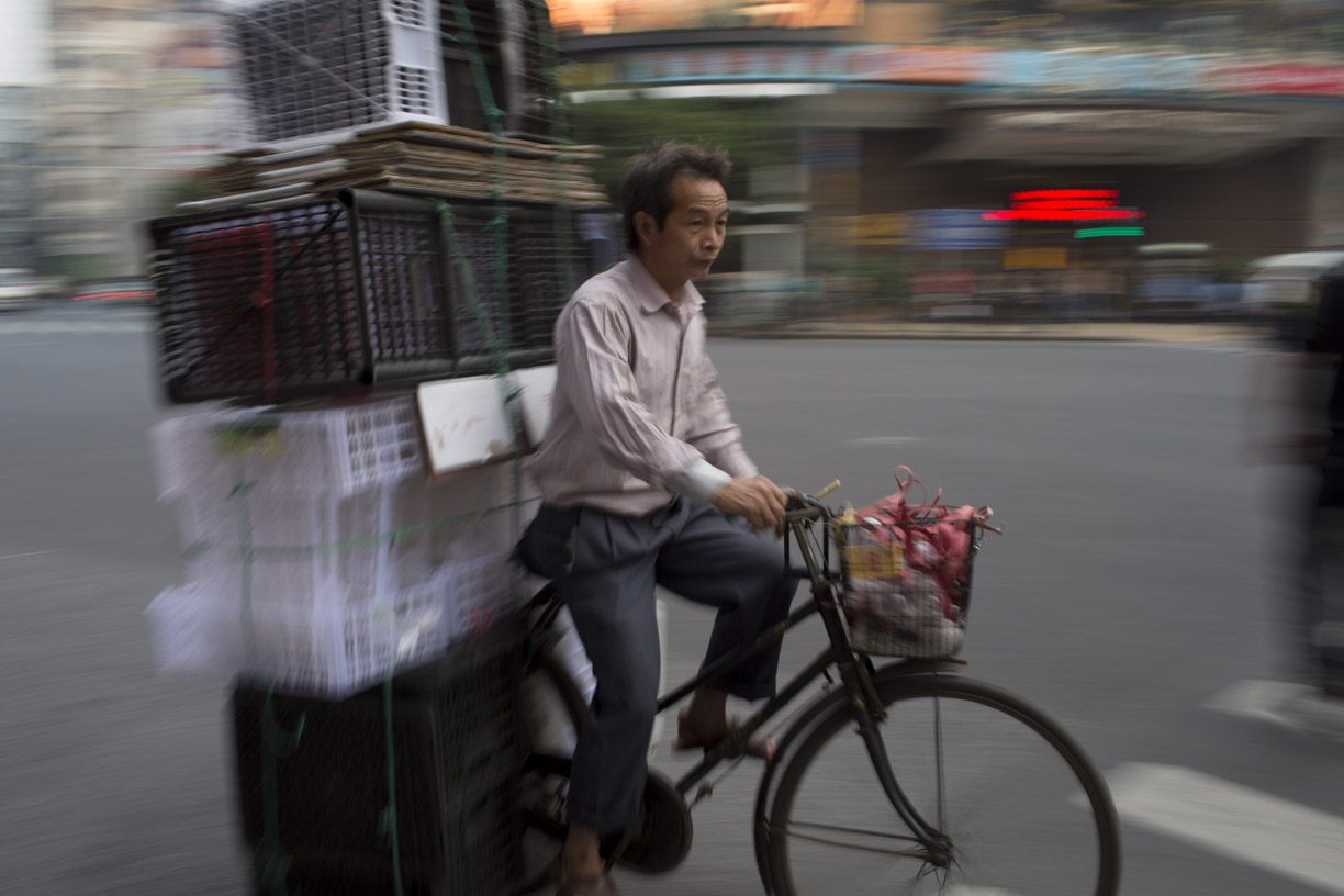 Man on bicycle, Guangzhou.