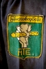 The government run Myanmar Timber Enterprise (MTE) logo is stitched to a loggers shirt.  