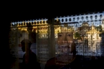 An image of the Buddha is seen behind a glass case at Botataung Paya.