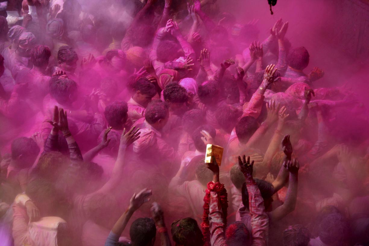 Revellers celebrate the Holi fesitval of colours at the Banke Bihari temple in Vrindavan, India.