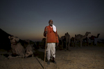 A camel trader poses for a photo in Pushkar. 
