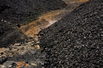 Mountains of coal stand at a transfer station in the Jaintia Hills. 