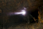 A young man emerges from a rat hole in the Jaintia Hills. 