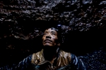 A miner takes a break inside a pit in the Jaintia Hills.