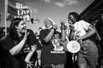 NYTFLOYD: Protesters  march with members from the organization, Families Supporting Families Against Police Violence near the  Minnesota State Capitol in St. Paul, MN on May 24, 2021. The group led a rally and march demanding justice for families that have lost loved ones to police brutality.