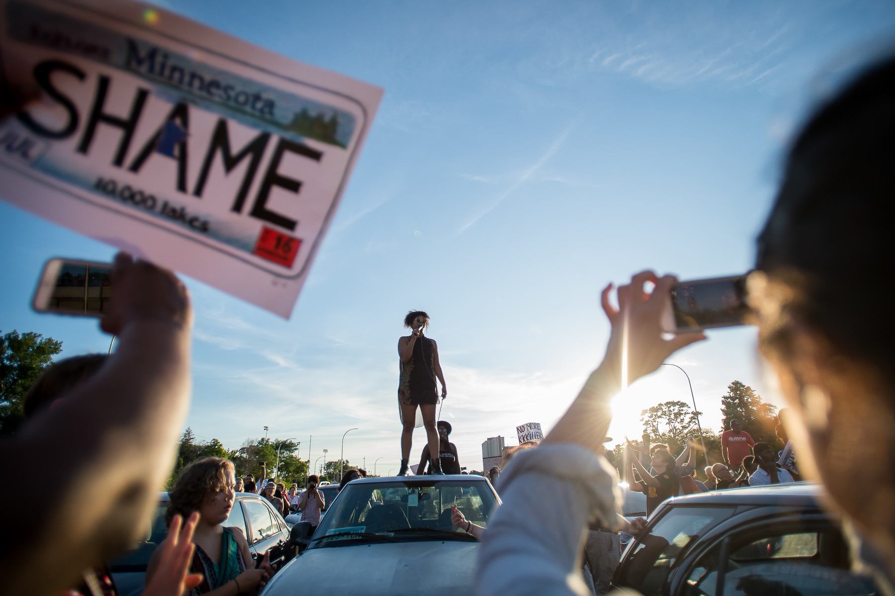 Mica Grimm speaks to a crowd of protesters that marched onto the freeway, shutting down Interstate 94 in St. Paul, Minnesota, USA on July 9, 2016, for several hours. Demonstrators marched in protest of the police killing of Philando Castile. On July 6, 2016, Philando Castile was shot and killed by a police officer during a traffic stop in Falcon Heights, MN. His death was broadcast on Facebook live by his girlfriend, Diamond Reynolds. The event sparked protests nationwide.