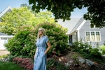MINNETONKA, MN - AUGUST 26, 2020: Mary Vevang Anderson, 54, of Minnetonka, MN, poses for a portrait outside her home. Living in a district that has been historically conservative but has flipped blue in recent years, Ve Vang Anderson is an undecided voter who voted for Trump in 2016, but can't bring herself to vote for him again in 2020. Vevang Anderson is a mother of 3, and owns her own  hair salon.