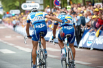 2004 STAGE 6 / Angers, France: Mikel Astarloza ushers his wounded teammate Jean-Patrick Nazon (Team AG2R) towards the finish line on July 9, 2004. 