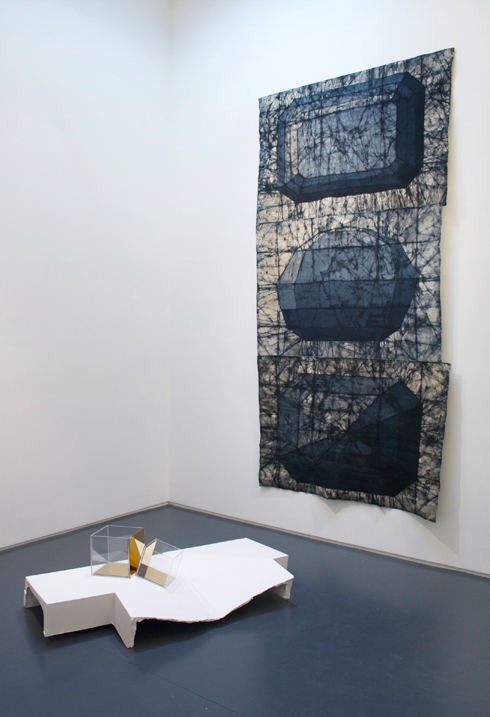 Installation view at Klaus von Nichtssagend Gallery, left to right: Gravity Well, 2013, Hydrocal, fiberglass, metal, acrylic, 57 x 16 x 28 inches; Conductor, 2013, Canvas, procion dye, wax, 120 x 59 inches.