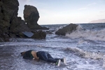 A body of a woman that had died when her boat sank is washed ashore, Lesbos, Greece, Nov. 1, 2015. 