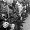 June 21, 2014. Members of a pro-Russian militia stand to attention, Donetsk, Ukraine. A show of strength at Lenin Square. I take out the new camera for the first time, then put it back in the bag. I don't want it to get smashed by an idiot. New cameras attract idiots.  