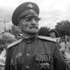 June 21, 2014. A war veteran, Donetsk, Ukraine. I start talking Serbian, the guy lets us be. An amazing old veteran with medals appears briefly from the crowd. I take two photos, he disappears. Can't find him. 
