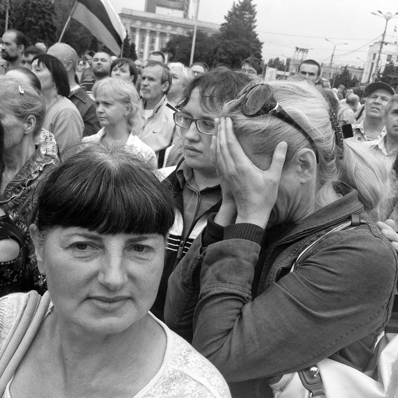 June 21, 2014. A woman weeps, Donetsk, Ukraine. The uniforms go away. All of a sudden, the square is full of civilians that are sad for no apparent reason. 