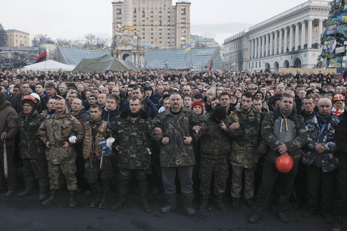 People gather at Independence Square for a funeral procession, Kiev, Ukraine, Feb. 21, 2014. 