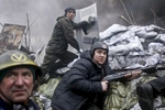 Armed protesters prepare to fire at police positions, Kiev, Ukraine, Feb. 20, 2014. 