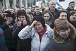 People grieve during a funeral procession, Kiev, Ukraine, Feb. 21, 2014. 
