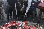 A suspected collaborator of the Yanukovych regime is made to pay respect to victims of clashes, Kiev, Ukraine, Feb. 22, 2104. 