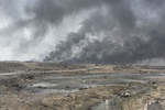 Oil wells set on fire by IS militants burn, Qayara, south of Mosul, Iraq, Oct. 27, 2016.