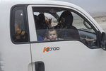 A family trying to flee from conflict is stopped at a checkpoint, Qayara, south of Mosul, Iraq, Oct. 23, 2016.