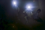 U.S. army soldiers from Blackfoot Company, 2nd Battalion, 23rd Infantry Regiment, detain a man during a night raid, Diyala province, Iraq, 2007.