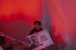 A woman attends an election rally and holds a poster depicting Aleksandar Vucic, a populist candidate with a strong nationalist agenda, who would later become Serbian prime minister and president, Belgrade, Serbia, March 3, 2014. In the 1990’s, Vucic was a prominent member of a Serbian ultranationalist political party tied to war crimes committed during the Yugoslav wars. 