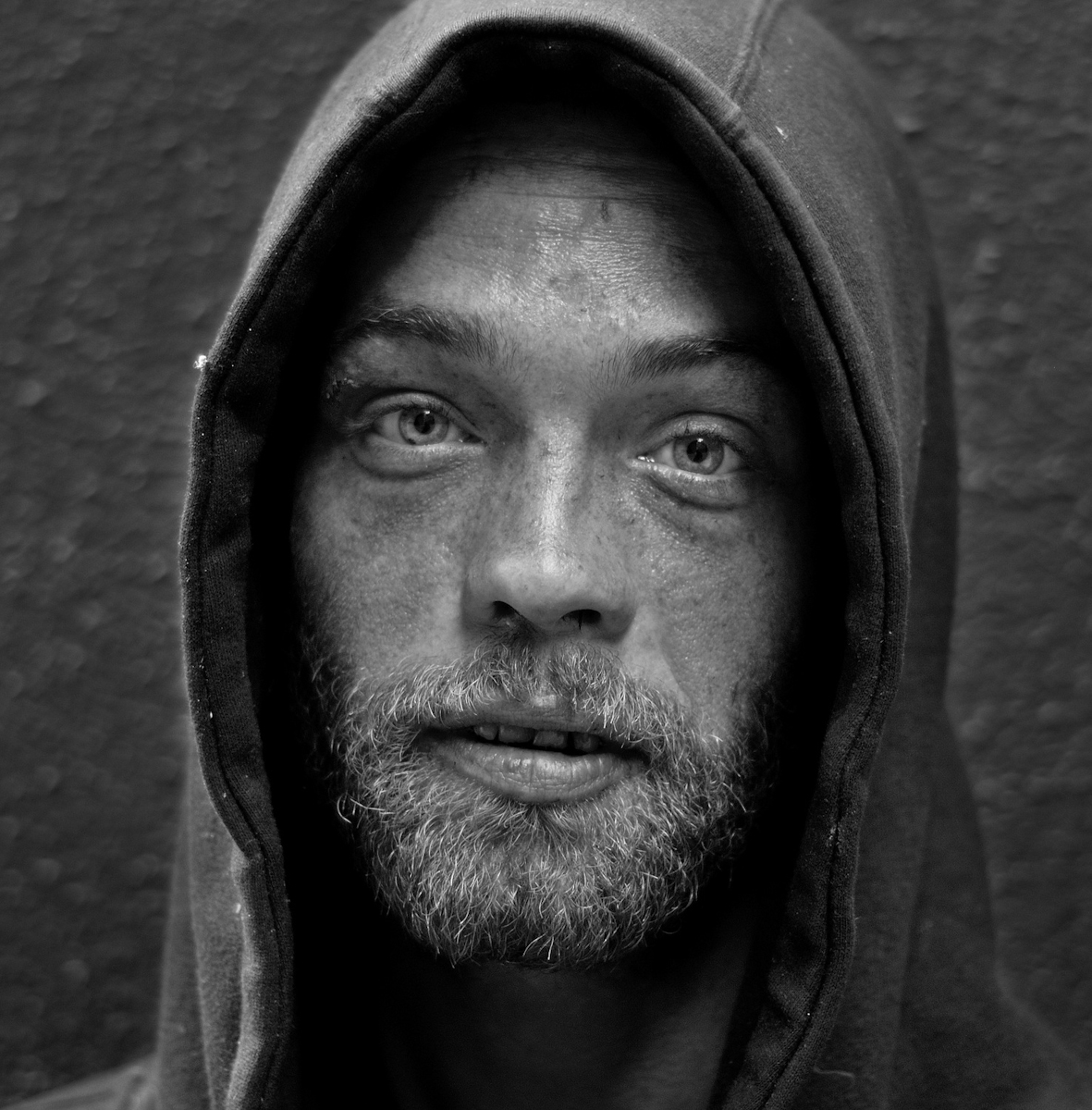 YOUNG HOMELESS MAN, SAN FRANCISCO, MAY 2006homeless brian from atlanta; people call him {quote}freelove.{quote} brian has been on the street since '98. as a child he lived mostly with his mother; and moved from state to state quite frequently.brian believes that the soul is not part of the body; rather that the body is part of the soul. he believes that his larger soul is extremely fragmented and possesses many incarnations; some simultaneous. he has memories from his other souls and his other bodies. he sometimes refers to them as ghosts; sometimes as dreams.he describes memories as a child of how his ghosts were used for physical acts by various family members and how his soul was sold to strangers.he describes how at 16 he was being used by a woman he didn't know. or it was a dream. or it was his ghost. but then he knew her and it was his mother. and she told him he was committing a sin and how could he be so sinful. and she tried to {quote}crush{quote} him as she tried to make him repent his sin.he believes that people you know can be connected to your seven chakras and thus be a part of you. his {quote}root{quote} chakra is a chinese girl he knew in '95 named ann. he met her in sacramento when he was living with his mother. he thought she was a gift and he didn't know how he had gotten so lucky. ann was there visiting a friend or such. she worked in a dotcom in sunnyvale.some time later, he went after her to sunnyvale to try and find her. he found her, but she would only see him in secret once a week and would make him call her daily in case she wanted to see him the following day. he was confused by her behavior and missed a day. he never saw her again. he felt her loss like a blow to the {quote}solar plexus{quote} and thus associates her with his {quote}root{quote} chakra. she is the love of his life.he says people are bad to him and people use him. he says, about 2 years back, his mother surgically removed his heart and sold it; and had him committed to a mental institution. he says his heart was his hero and he can no longer be a hero without that heart. but he says he had a spare {quote}less modern{quote} heart as a backup.he says things keep getting worse for him. he says he sold his soul to the devil so as to stop his slide. he says he's given himself to evil so that when others do evil to him, it can be no worse. he doesn't believe in actually doing evil to others, however. he says he visits hell frequently. he says that satan is his mistress; but that he's trying to reform {quote}her{quote} so that there will be no more evil in the world.but he's not sure he can. and he feels he's gone too far. he says he needs help soon. he hopes that someone will give him a way out. but he doesn't believe there's much time. he says soon he won't be able to turn back. but for now, there's still time.(5/15/06)