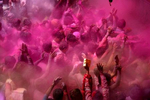 Indians celebrate the Holi fesitval of colours inside Vrindavan's Banke Bihari temple.  Of the many festivals in India, Holi is among the most vibrant and joyous. It is a unique celebration in that India shuts down completely and people take to the streets to douse each other in coloured powder, or gulal, and literally paint the town red.  Cultural norms are suspended in the name of fun and distinctions of caste and religion are forgotten. 