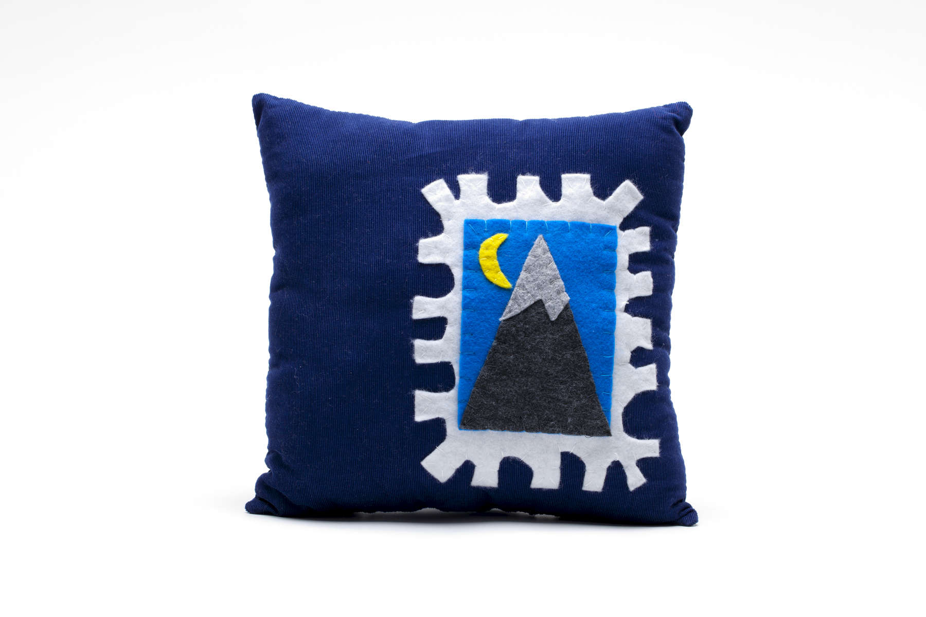 pURCHASE hEREhandmade royal blue corduroy pillow featuring a hand-stitched stamp made of felt. that depicts a mountain + a moon. measures approximately 11 x 11 inches // crafted + hand-sewn in boulder, colorado.
