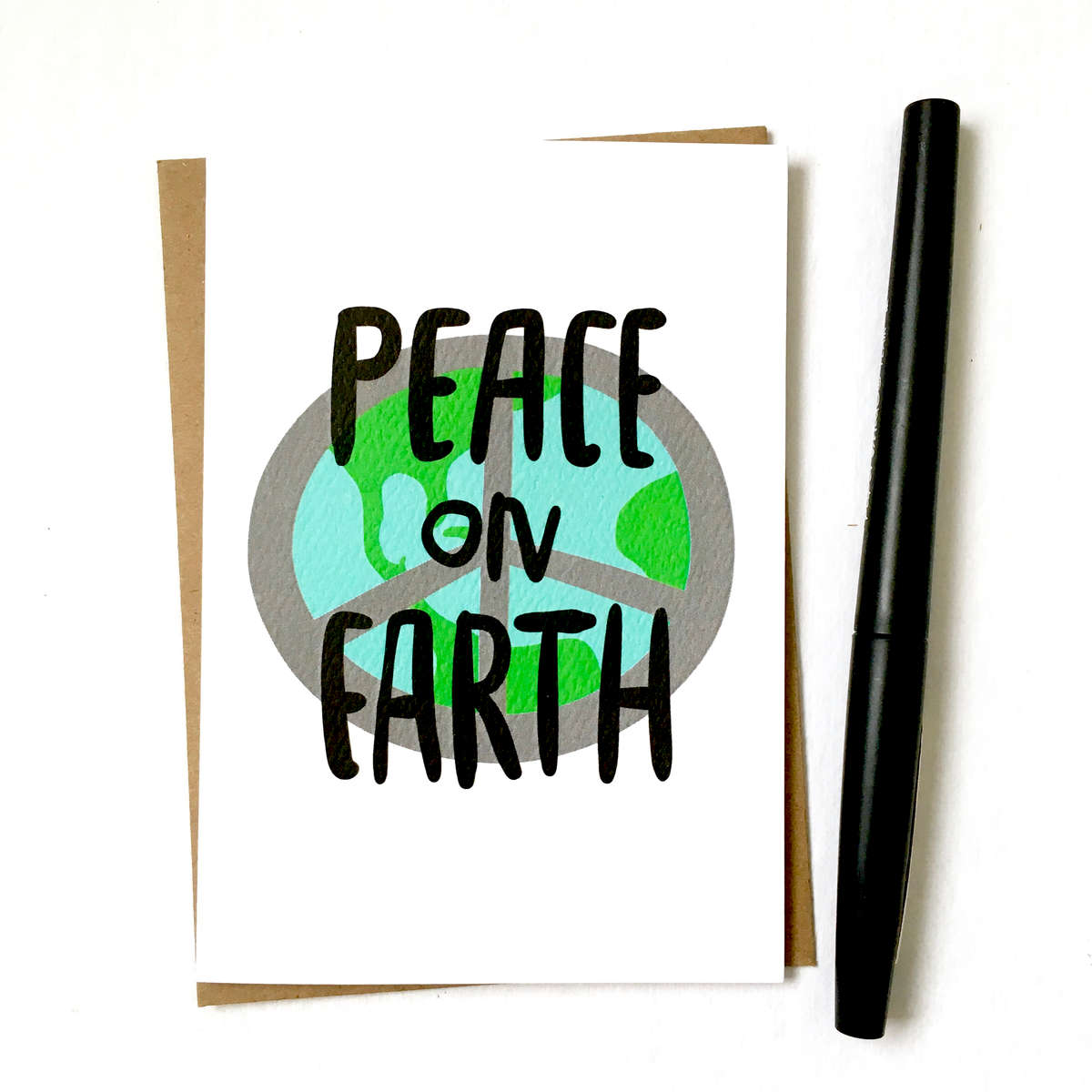 purchase herepeace on earth... seems simple enough, right?! // this brand new holiday card is the perfect little reminder of what this season is really all about // snag yours now while they're still in stock!each card is:printed on 100# recycled + responsibly-sourced paper //measuring 3.5{quote} x 5{quote} //accompanied by a recycled kraft paper 4-bar envelope //professionally printed on a digital press //individually packaged in sealed cellophane sleeve //made with mad love in colorado, usa. 