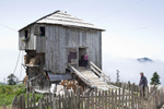 A Georgian family in the Adjara region lives in this house during the summers, a standard practice for farmers in the area. Usually, the houses are more than one hundred years old, and livestock lives on the first floor while the family sleeps on the second.