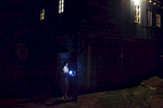Night in Mountanious Adjara region. Newly engaged girl, giving a flashlight to her neighbor. kid.