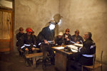 Georgia, Chiatura City. Miners are assigned their duties before their shifts begin.