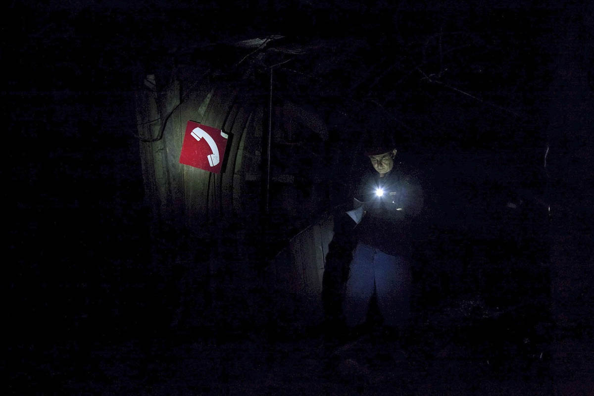 Georgia, Chiatura City. Mineworker, head of duty, night shift. Examining for any failed machinery. Machinery in mines has never been upgraded. It has never been stopped for repairs and is replaced only if it fails during work.