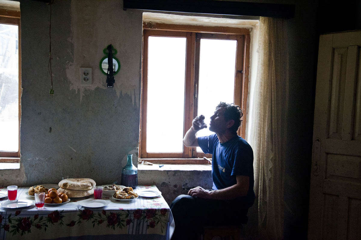 Georgia, Chiatura City. Mineworker Zaza, a father of 15 kids at home, drinking Tchatcha (Georgian vodka).