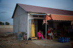 A general store that provides goods for the workers at the New World mega housing project on the outskirts of Phnom Penh. They are mostly from the country side and earn anywhere between five to ten dollars per day depending on their skills. December 2011