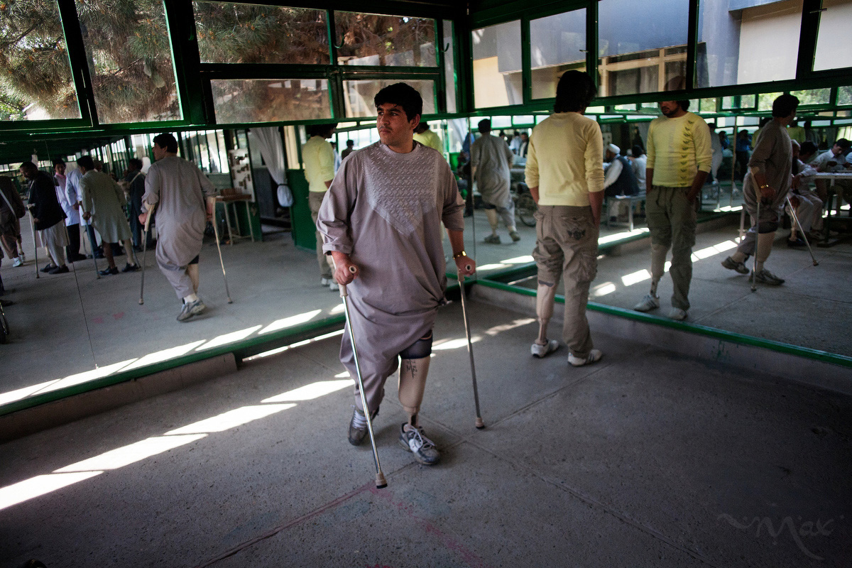 Patients practice walking with prosthetics received from the Red Cross along with other victims of mine blasts at the ICRC rehabilitation clinic in Kabul, Afghanistan on April 27, 2010. The International Committee of the Red Cross (ICRC) manages six physical rehabilitation centers across Afghanistan and maintains a workshop manufacturing prosthetic/orthotic limbs for war victims and those with other disabilities. The doors to the clinic are open to all Afghans who are wounded for any reason. 