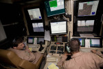 Pilots with the United States Air Force's 62nd Expeditionary Reconnaissance Squadron prepare to launch a MQ-1 Predator from the Kandahar Air Field from a trailer equipped with a full array of piloting computers and readouts on the flight line. The U.S. Air Force currently fields 130 of the $3 million aircraft which can be armed with two laser-guided AGM-114 Hellfire missiles.