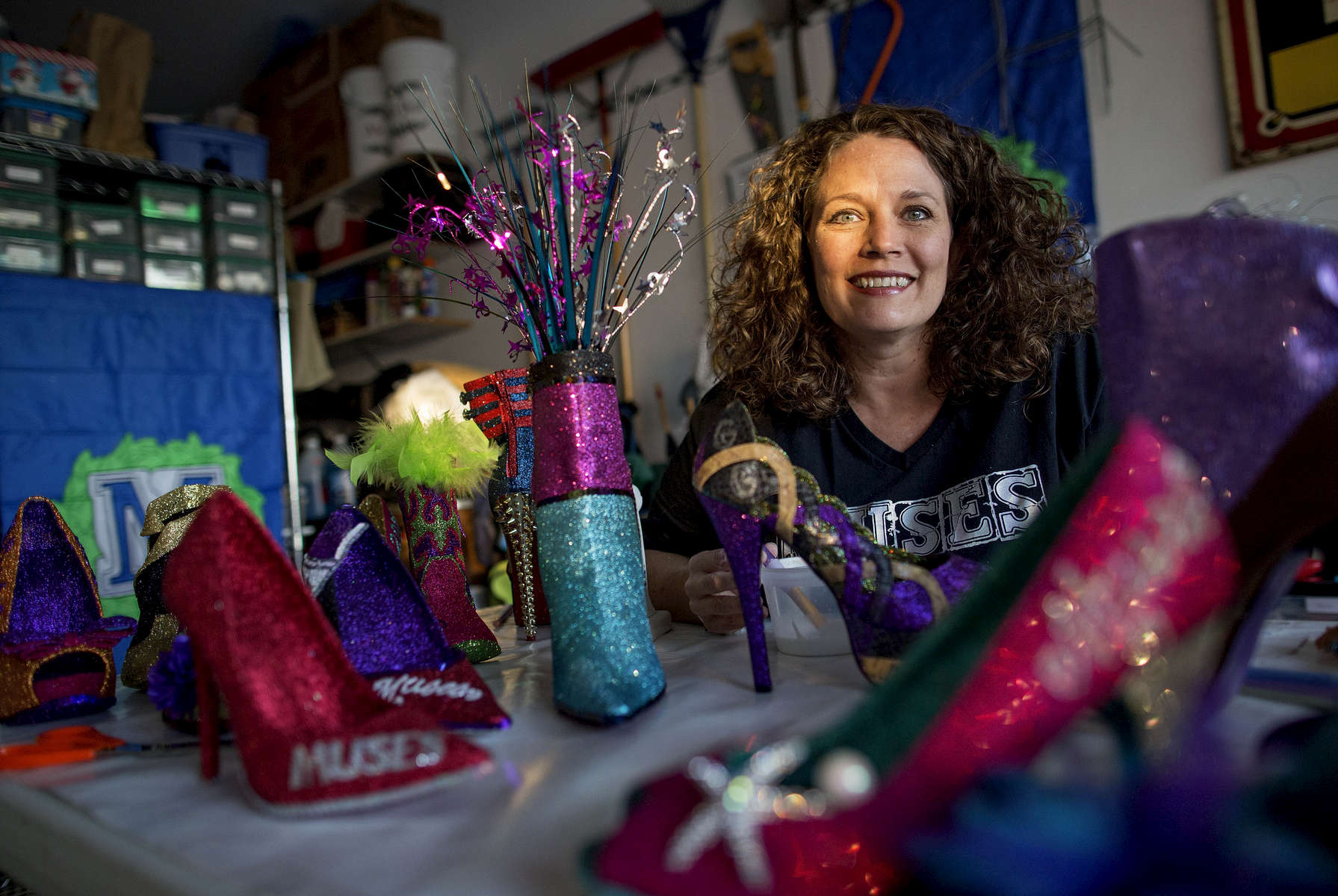 KENNER, LOUISIANA. Cari Rhoton, a lieutenant in an all-female Mardi Gras parade group known as the Krewe of Muses, creates the group's signature shoes from her garage in Kenner, La., Sunday, Jan. 10, 2016. Over 1000 members of the organization ride floats and pass out hand decorated shoes and other trinkets during Mardi Gras. (AP Photo/Max Becherer) 
