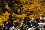 The men of Khenj, Afghanistan, watch a game of buzkashi on Friday, October 26, 2007.  