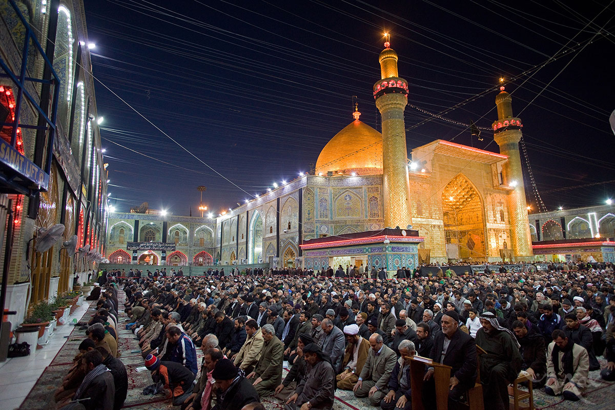 Shiite worshipers perform the evening prayer at the holy shrine of Imam Ali in Najaf, Iraq on Thursday January 6, 2010. In 2004 Muqtada al-Sadr's Mehdi Army took over the shrine and fought American forces in the city in a bloody battle. Residents of the city have mixed feelings about al-Sadr's return. Anti-American cleric al-Sadr led Shiite resistance fighters against the American-led forces in several bloody battles before fleeing into exile in Iran over four years ago. His return to Iraq is being welcomed by his supporters. 