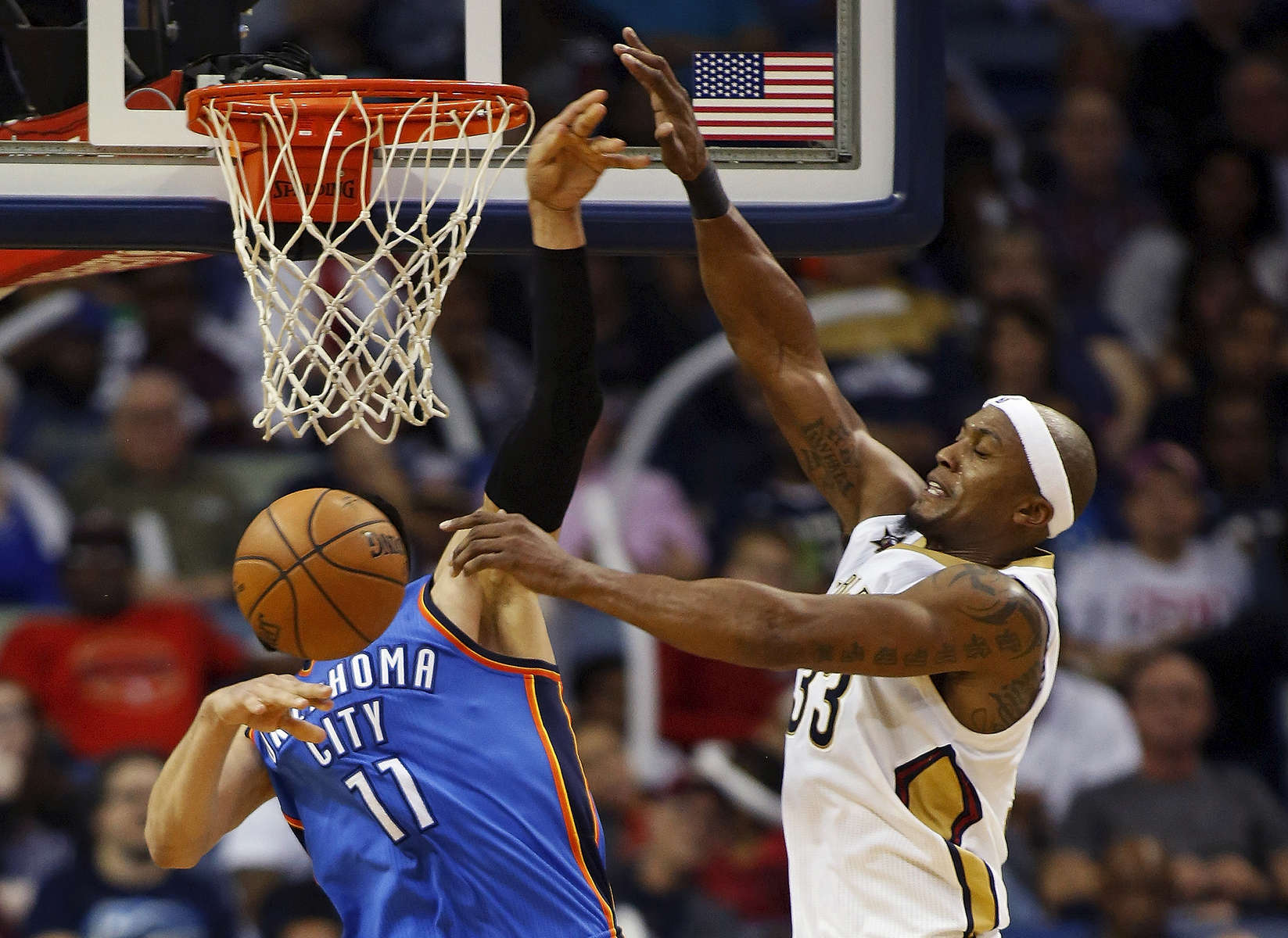 New Orleans Pelicans forward Dante Cunningham, right, blocks an attempted layup by Oklahoma City Thunder center Enes Kanter (11) in the second half of an NBA basketball game in New Orleans, Wednesday, Jan. 25, 2017. The Thunder won 114-105. (AP Photo/Max Becherer)