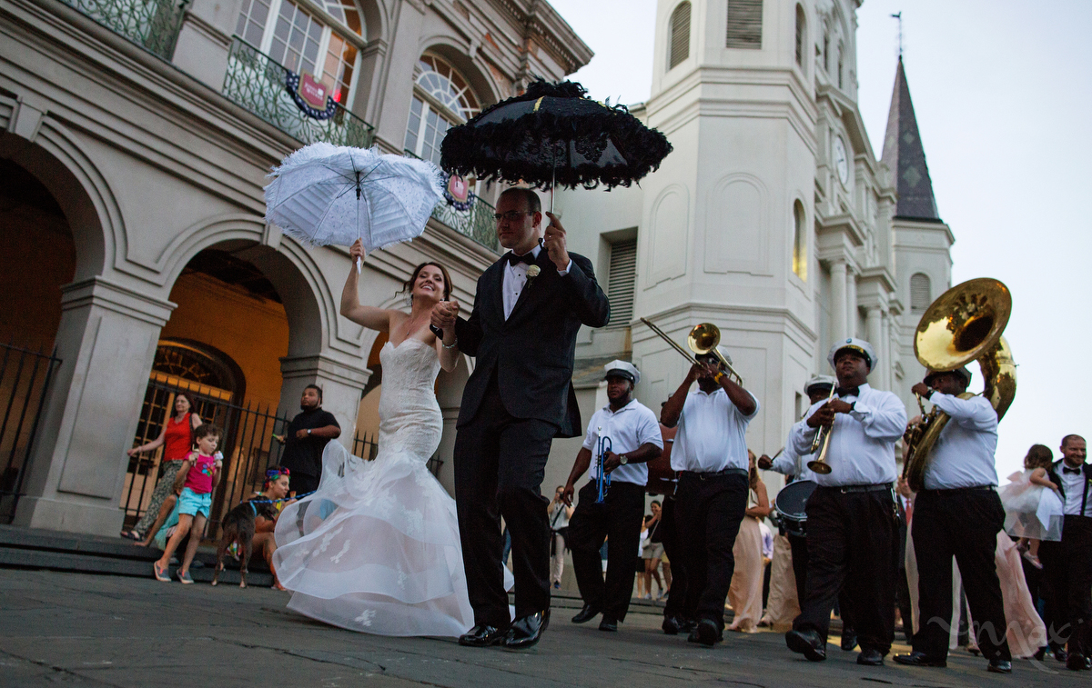 NEW ORLEANS, LOUISIANA. Newlyweds Todd Ledet and Megan Bendig dance their way out of St. Louis Cathedral at Jackson Square in the French Quarter of New Orleans, Saturday, Aug. 15, 2015. Hurricane Katrina put roughly 80 percent of the New Orleans under water. Hundreds of people drowned inside their homes, their bodies floating in the muck. Hospitals and police were overwhelmed. The city emptied. Now, as people describe the city’s resurgence, they reach for metaphors that verge on the Biblical: a resurrection, an economic and cultural renaissance, a rebirth. (AP Photo/Max Becherer) 