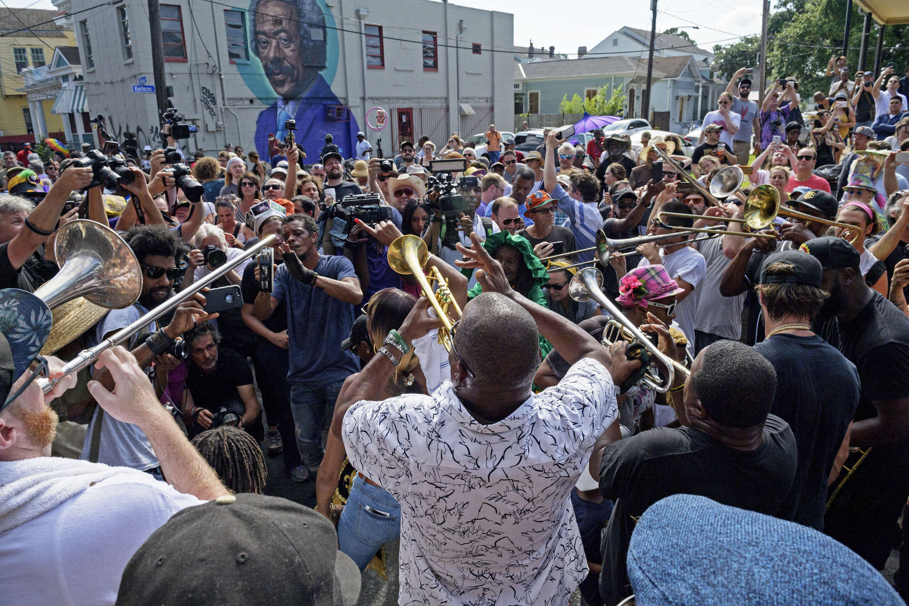 Trumpeter James Andrews leads a second line for Malcolm {quote}Dr. John{quote} Rebennack, who died Thursday at age 77, as it pauses in front of a mural of Allen Toussaint on Claiborne Ave. in the Treme in New Orleans, La. Friday, June 7, 2019.