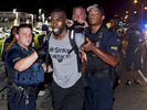 Baton Rouge police officers arrest a prominent Black Lives Matter activist, DeRay Mckesson, for allegedly obstructing a highway during a protest in support of justice for Alton Sterling in Baton Rouge, La. Saturday, July 9, 2016. Video shot by Mckesson in the moments before his arrest show him walking alongside Airline Highway on his way back to the main area where the protests were going on when he was arrested. (AP Photo/Max Becherer)