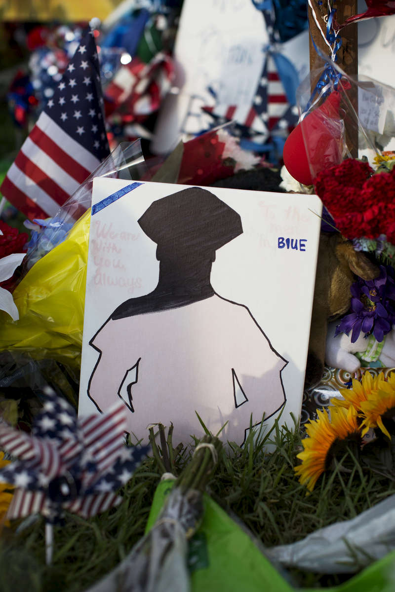 Hand written notes and mementos have been left at a makeshift memorial in front of the B-Quick convenience store after 3 law enforcement officers were killed by a gunman on Sunday in Baton Rouge, La. USA, Wednesday, July 20, 2016. According to authorities from the East Baton Parish Sheriff's Office the three deceased officers were identified as Baton Rouge Police officers Matthew Gerald, 41, of Denham Springs and Montrell Jackson, 32, and Brad Garafola, 45, of the East Baton Rouge Parish Sheriff's Office. (Max Becherer/Polaris)