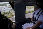 Louisiana Gov. John Bel Edwards, right, reviews a shored up breach in a levee dam that the Louisiana National Guard filled using 362, 4000-lb. sand bags that were put in place with a helicopter near Gueydan, La. USA, Thursday, Aug. 25, 2016. {quote}Though we are bringing to bear all the FEMA relief we can and what's allowed by statute, it's not going to be enough to make people whole, and that's unfortunate,{quote} Louisiana Gov. John Bel Edwards said. (AP Photo/Max Becherer)
