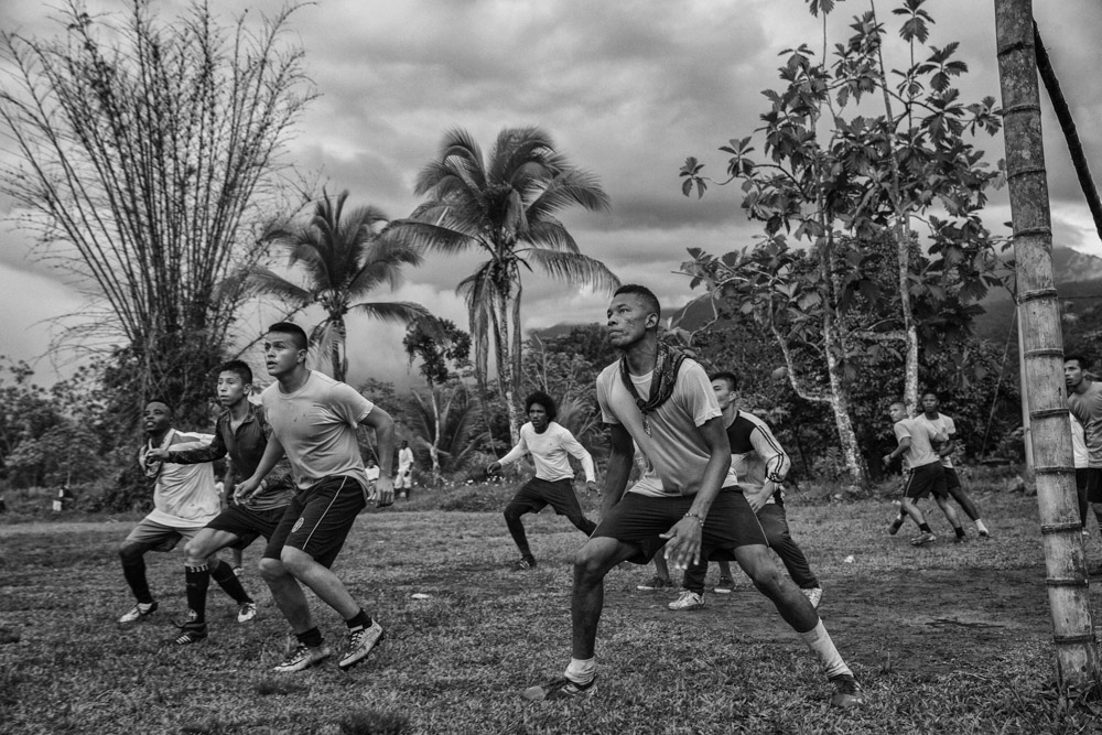 September 16, 2017. Vegaez, Antioquia, Colombia. Members of the FARC soccer team of the Transitional zone of Vigia del Fuerte on the right prepare to play a match against the 94th infantry Battalion of the Colombian Armed forces who provide security for the former FARC members as they transition into civilian life.