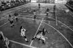 September 25, 2017. La Elvira, Cauca, Colombia. FARC women soccer team (black) play against the local village of La Esperanza at the transitional zone’s indoor football court. After the peace agreement was signed between the Colombia Government and FARC in October of 2016. FARC members were divided into 26 transitional zones.  The women’s soccer teams since April of 2017 have started to play game with local communities. Xiomara Mendez recalls that in times of combat they would play soccer in the middle of the jungle and two women were always included in the men’s team but never had the opportunity to play all women’s games.