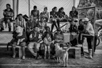 September 25, 2017. La Elvira, Cauca, Colombia. Some local residents from the nearby villages of Los Robles and El Cedral come to support their local teams, and members of the FARC women’s soccer team and fellow comrades sit on the stands in between games. The women’s soccer teams since April of 2017 have started to play game with local communities. Xiomara Mendez recalls that in times of combat they would play soccer in the middle of the jungle and two women were always included in the men’s team but never had the opportunity to play all women’s games.