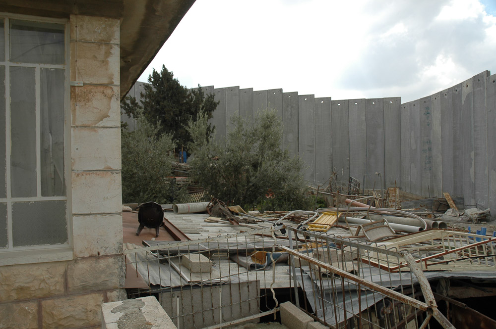 Abu Dis, a Jerusalem suburb, is separated from Jerusalem by a 26 ft concrete wall. It snakes in and out separating houses, and families.